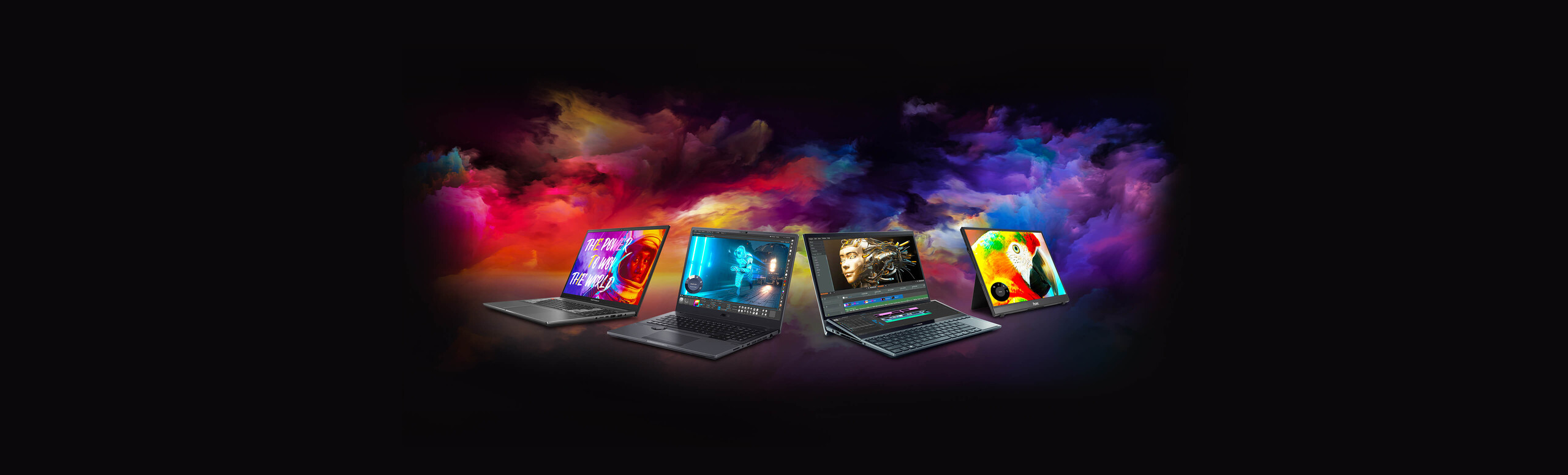 Four ASUS laptops placed in different angle with colorful image on the screens.