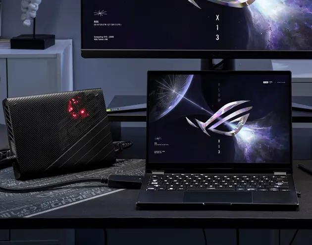 Flow X13 placed on a table and connected with external ROG XG Mobile external GPU.