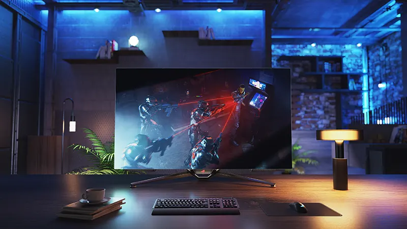 ROG Swift OLED gaming monitor on desktop setup
