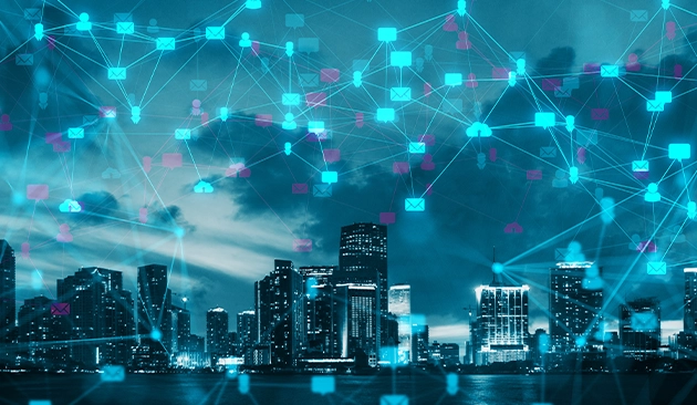 City skyline with digital cloud and network connection icons representing data communication.