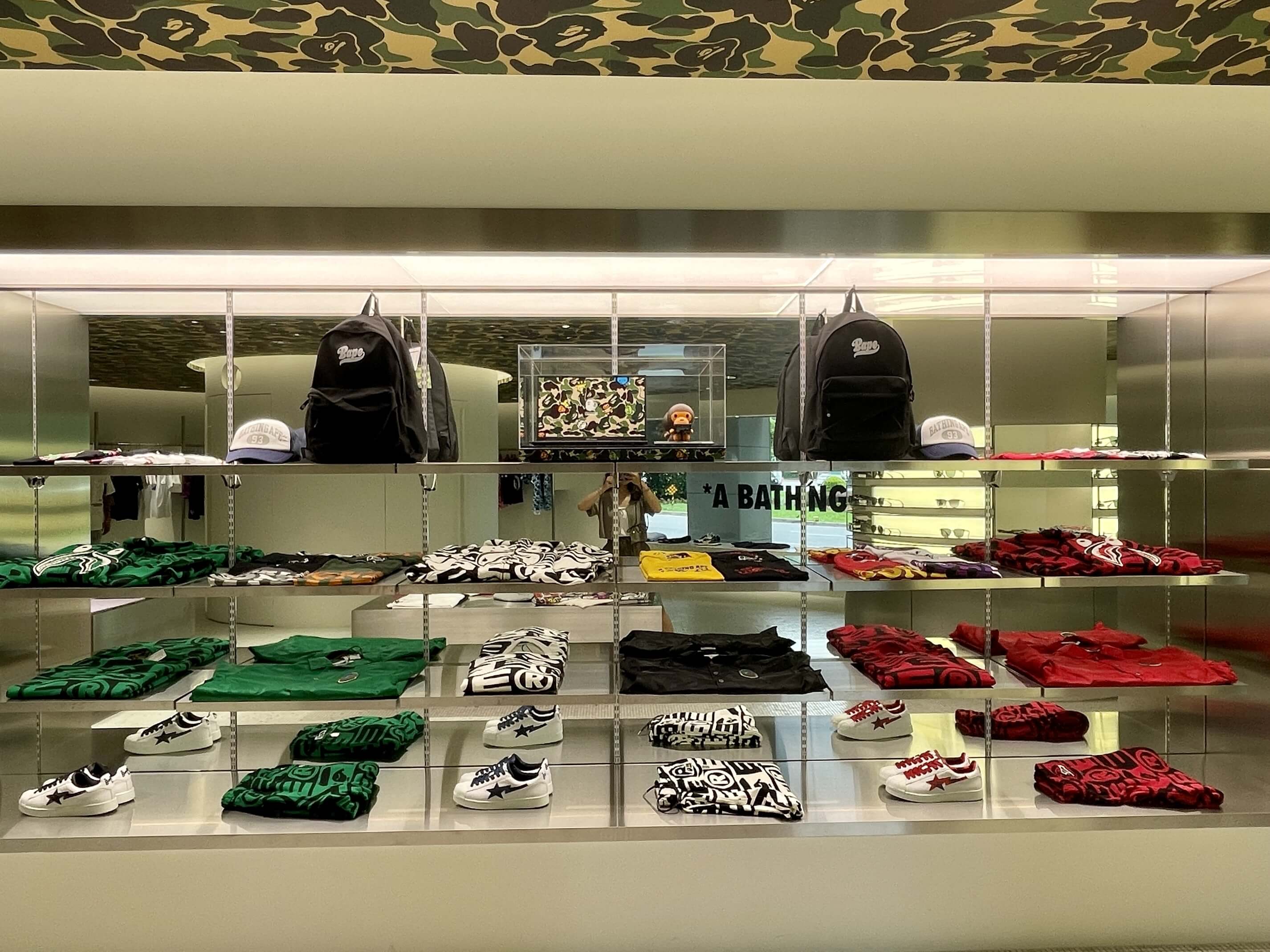 The image shows ASUS vivobook bape edition stand at BAPE store