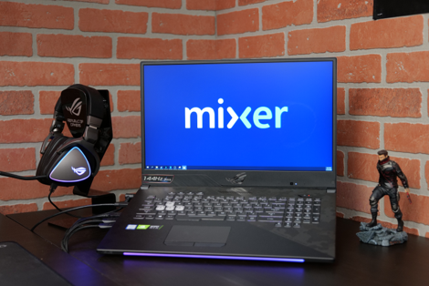 ROG gaming setup with Mixer logo on screen and ROG Headphone on desk