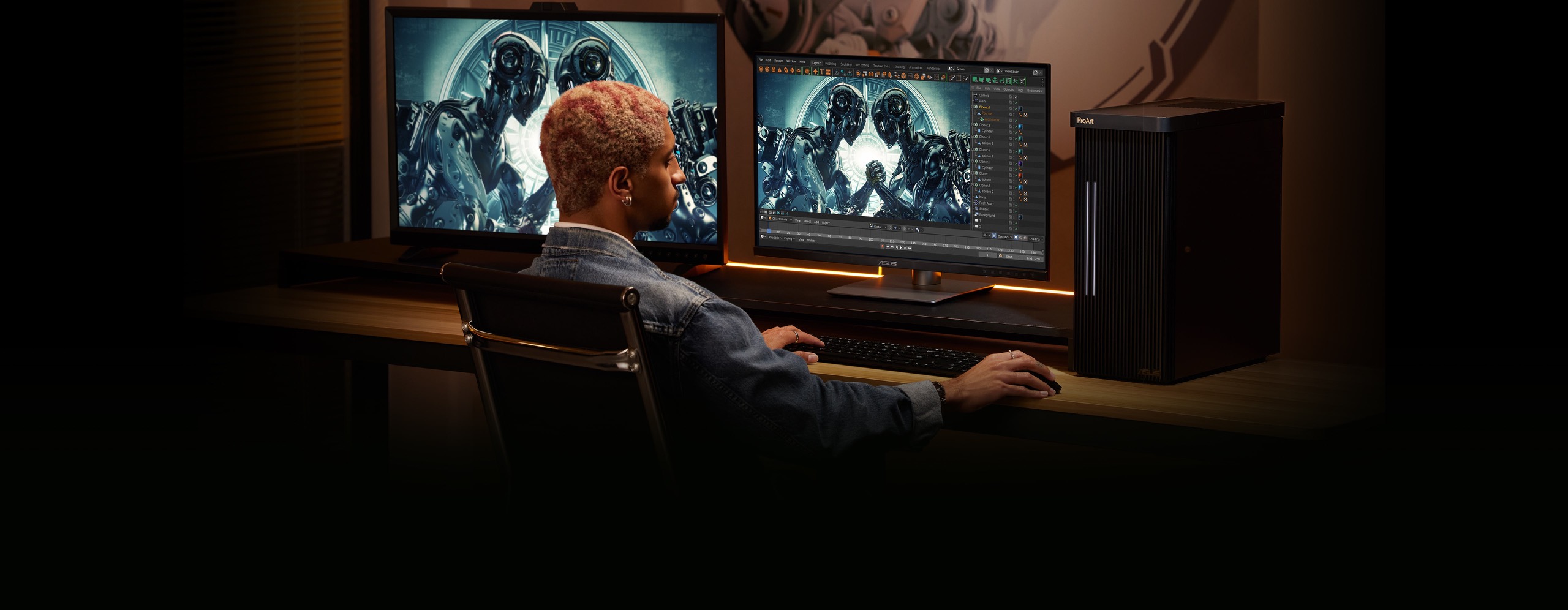 Egy ember székben ülve tartja az egeret, miközben gépel a billentyűzeten. A külső monitor a bal oldalon, a PC középen, a munkaállomás pedig jobb oldalt helyezkedik el. A hallban az íróasztallal szemközt egy kép lóg a falon.